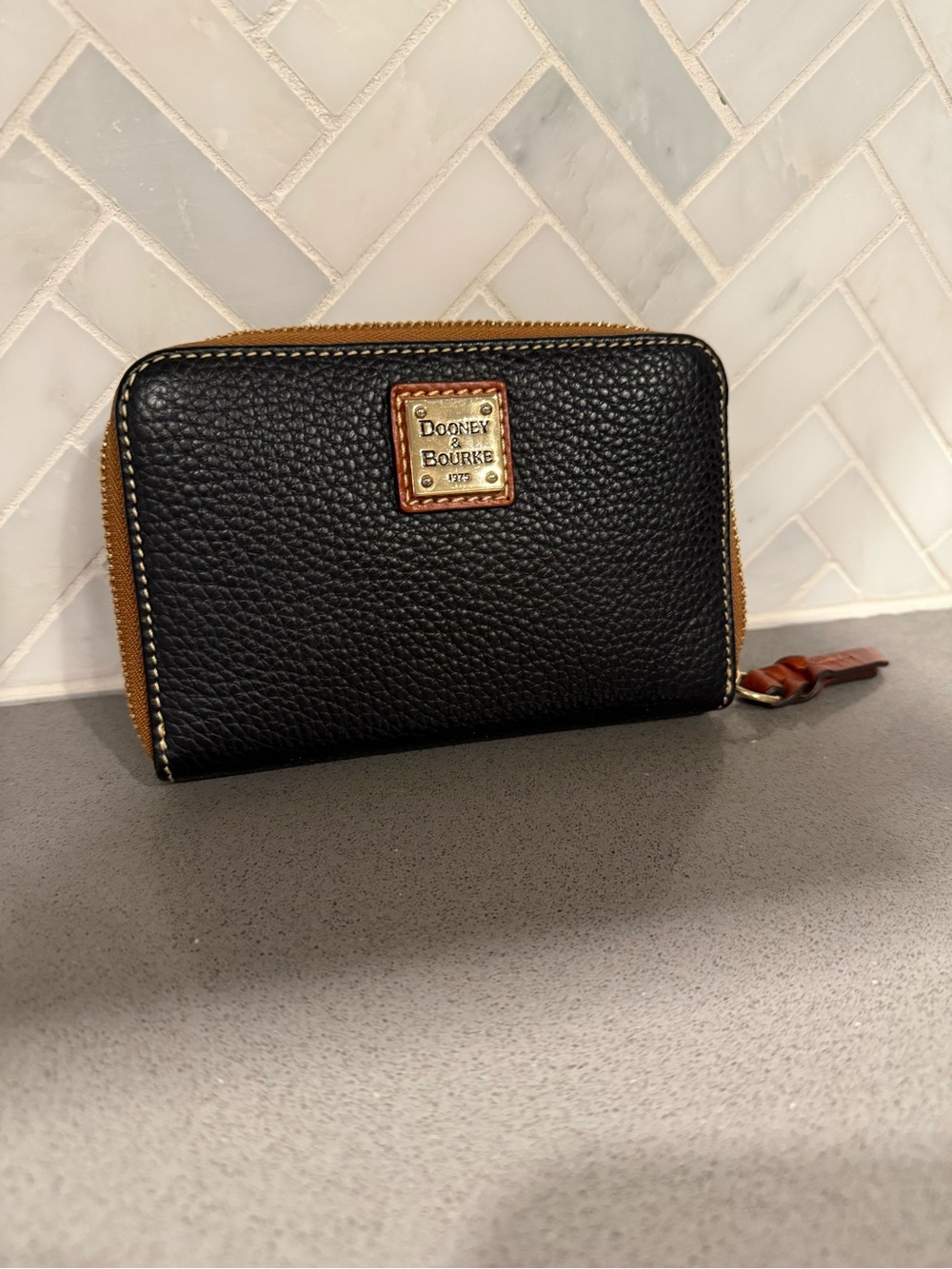 Dooney & Bourke Black Pebbled Leather Zip Wallet with Tan Trim